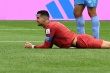 La star portugaise Cristiano Ronaldo grimace lors  - © AFP