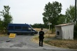 Un gendarme monte la garde sur une route barrée m - © AFP