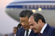 Le président chinois Xi Jinping (g) écoute son h - © POOL/AFP